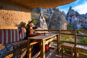 Scenic view of a Morocco private tour with desert landscape, camel ride, and traditional Moroccan architecture.