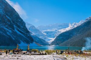 Scenic view of Lake Louise with turquoise waters surrounded by majestic mountain peaks during a half-day tour.